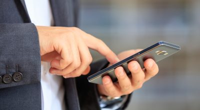 Businessman holding a smartphone Businessman holding a smartphone